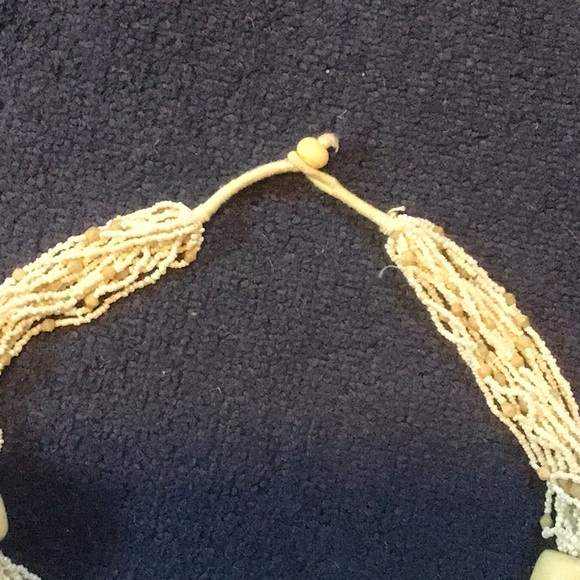 Multi strand tassel necklace w/ ivory like large ornaments - Picture 3 of 3